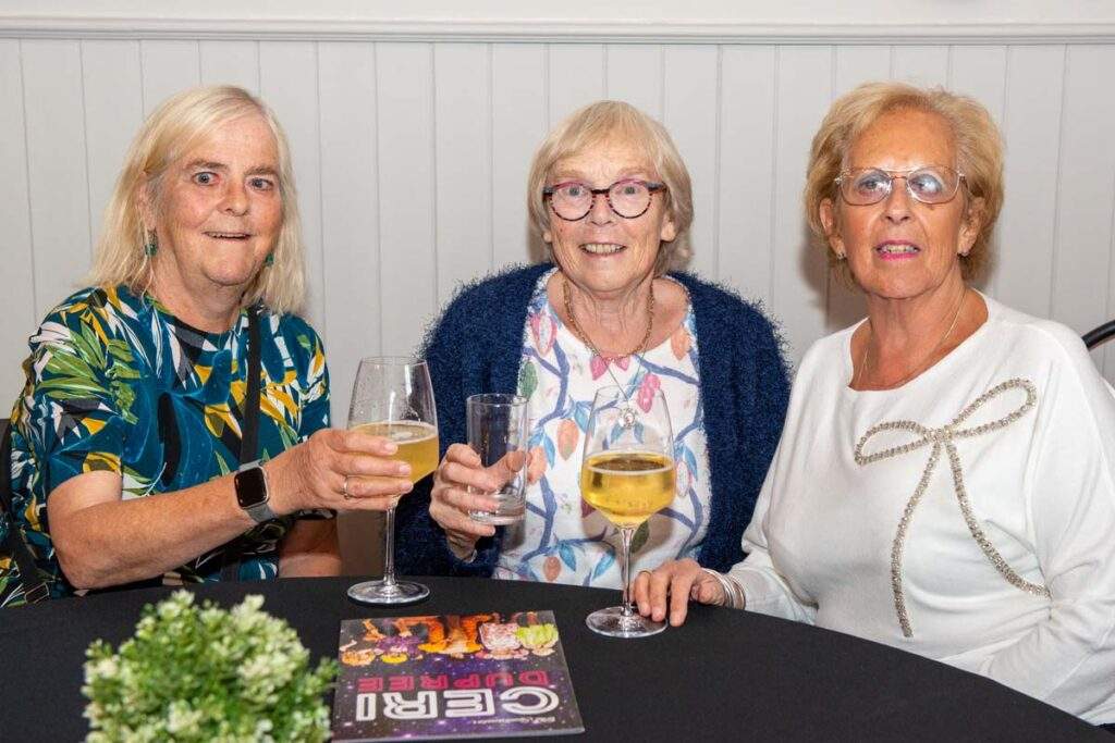 Three women enjoying drinks together at a table during Sight Life's Afternoon Tea with Ceri Dupree at Cornerstone, Cardiff.