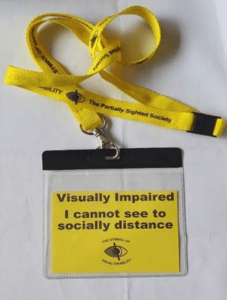 Picture of a bright yellow lanyard inidcating the wear has sight loss