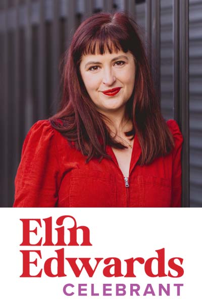 Square photo of Elin Edwards in a red top. Her long brunette red hair falls down over her shoulders and she's wearing red lipstick to match her top. She's smiling gently to camera. Beneath is Elin's red logo on a white background.