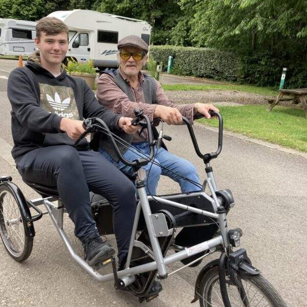 IMG_0760 Volunteer William Lawrence and member Kevin on a by side bike at Pedal Power