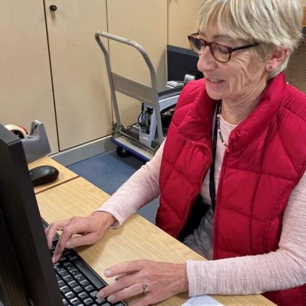 IMG_2934 Volunteer Elaine Rees on the computer at Sight Life