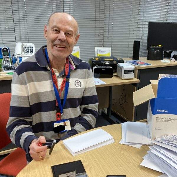 InkedIMG_1903 Volunteer David Jones stamping envelopes in the office