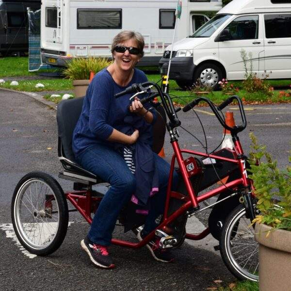 Volunteer Jane McCann on a bike at Pedal Power