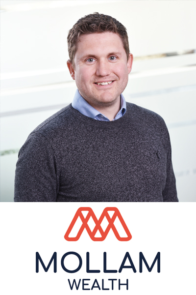 Square photo of Paul Phillips in a pale blue shirt and grey sweater smiling to camera. Beneath is the Mollam Wealth logo on a white background.