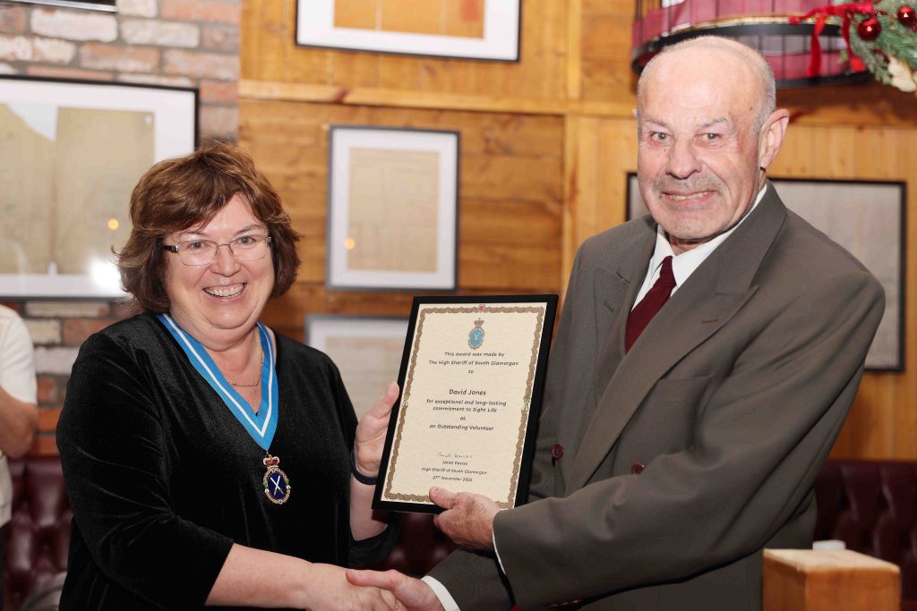 High Sheriff, Janet Davies, presents David Jones with a certificate for outstanding achievement in Volunteering