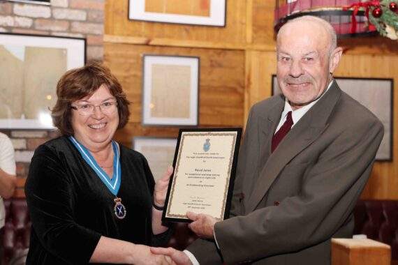 High Sheriff, Janet Davies, presents David Jones with a certificate for outstanding achievement in Volunteering