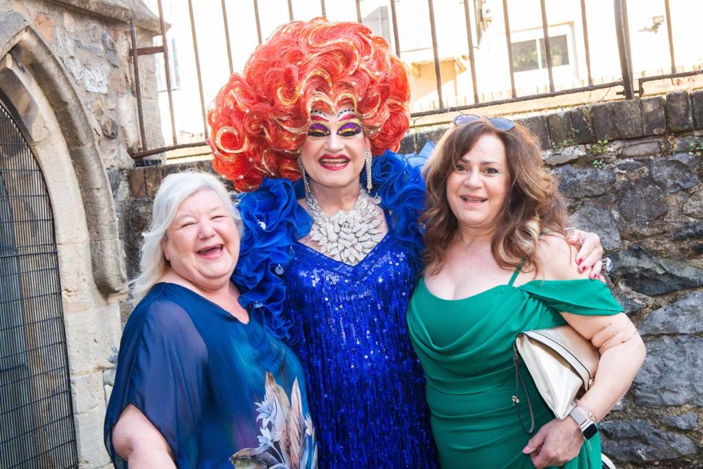 A portrait of Miss Moist with two female guests.