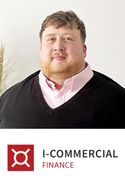 Square photo of Sam Fairclough in a pale pink shirt and black v-neck sweater smiling to camera. Beneath is the I-Commercial Finance logo on a white background.